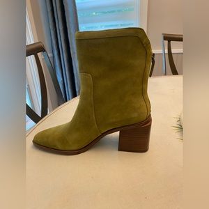 Brand new waterproof suede boots by known designer in a stylish suede green.